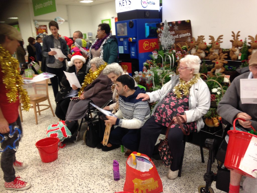 Residents at Churchfields care home singing carols to our customers #becauseitschristmas