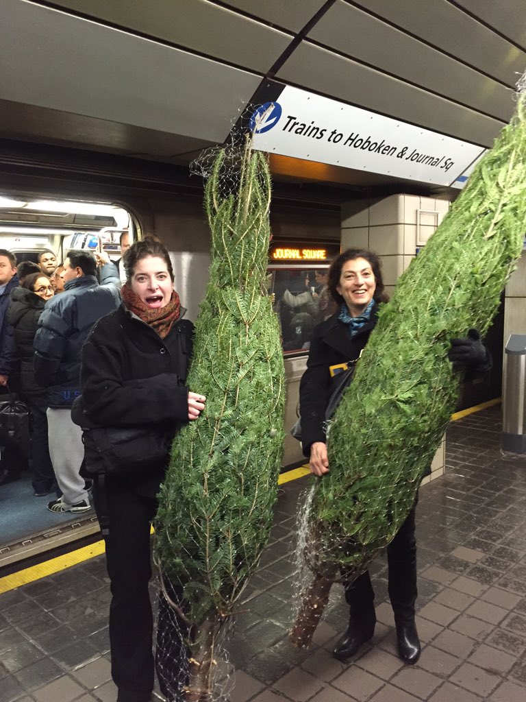 NYPassport's tweet photo. Schlepping trees home via  @PATHTrain #newyorktreesarethebest https://t.co/9DgH7k9SpB