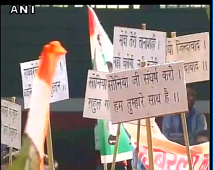 ANI's tweet photo. Congress workers gather outside party HQ in Delhi #NationalHerald https://t.co/13GUm7XmHS