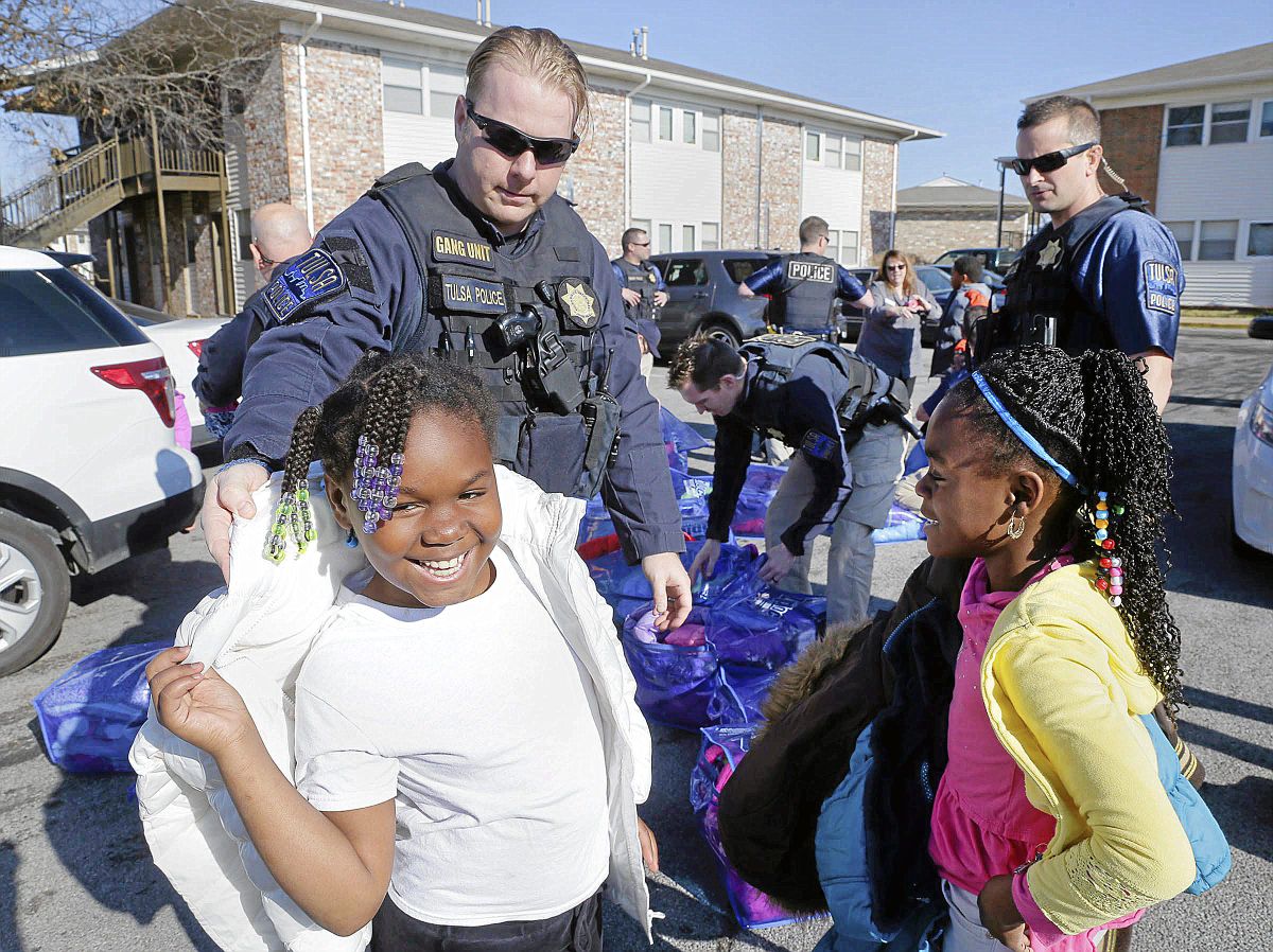 Gang Unit officers take guns off Tulsa streets, put coats on needy kids' backs. ow.ly/WcNmz