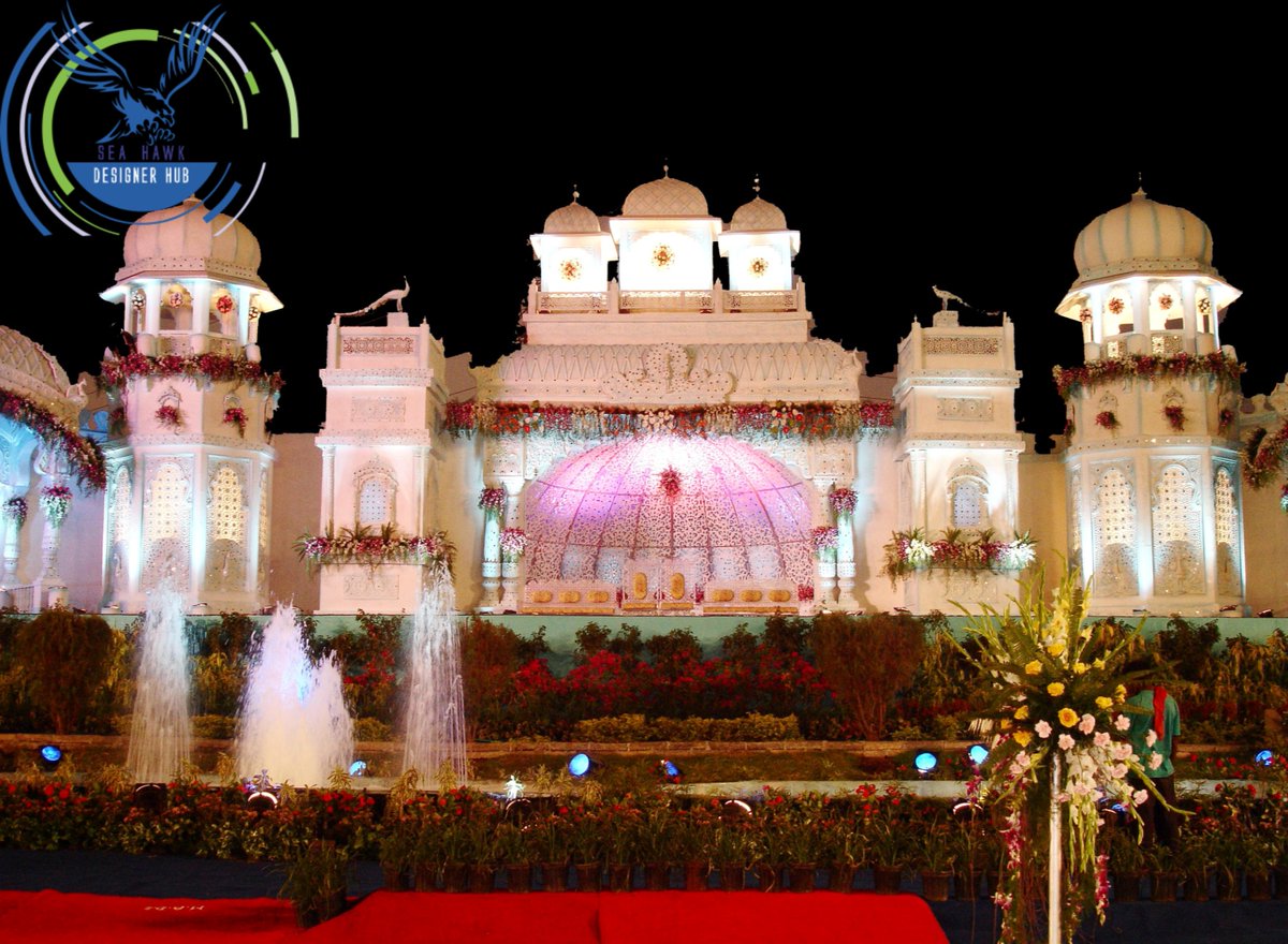 HubSeahawk's tweet image. The props are fewer, but bigger, filling up the blank spaces at the wedding venue.