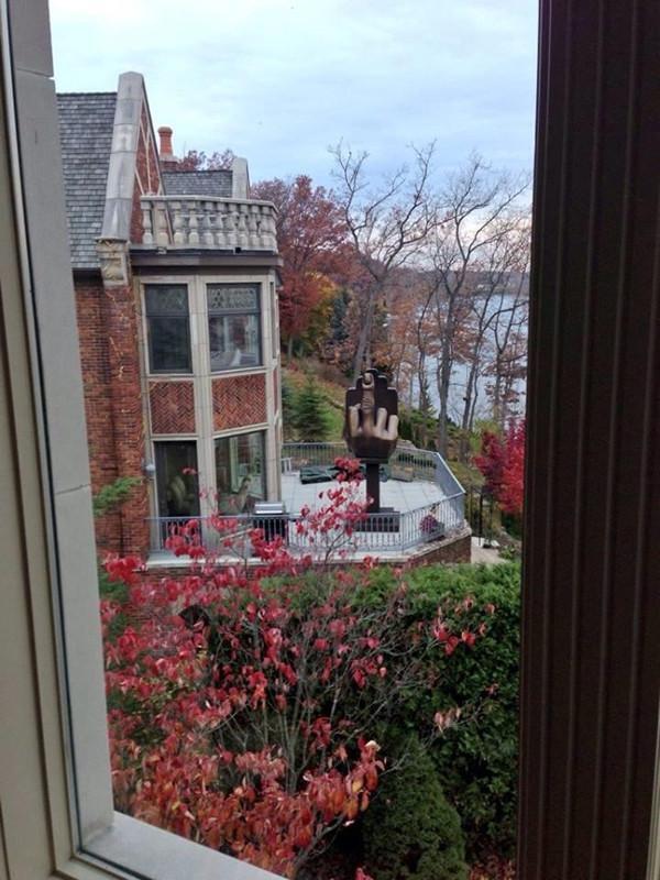 Fact's tweet photo. A man bought a house next door to his ex-wife and installed a giant middle finger statue... https://t.co/GgSRhkPAD0