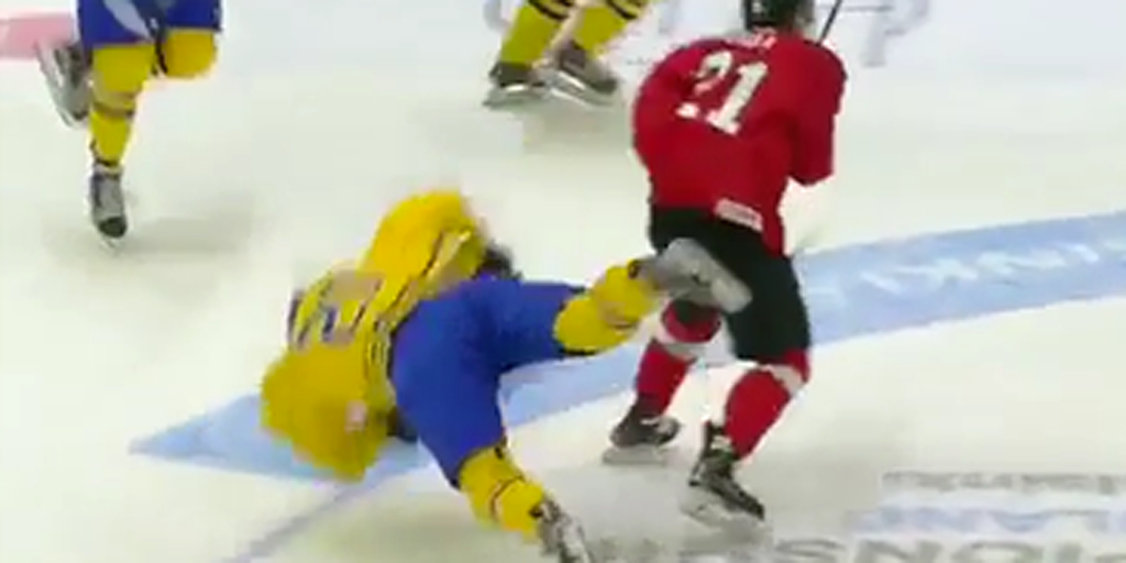 theScore's tweet photo. VIDEO: Sweden's William Nylander victim of devastating open-ice hit. https://t.co/PY9MIHs0S0 https://t.co/0Ba6Dm4szq