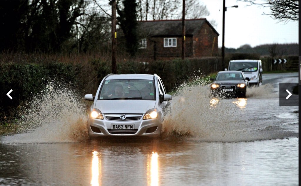 Great pic of a driver using a phone whilst driving #floods
