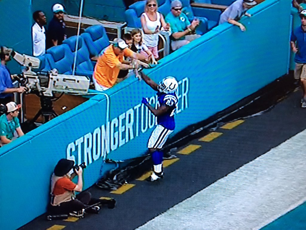 NFLMemes's tweet photo. Dolphins fans have given up to the point where they're high-fiving other teams players... https://t.co/EQBKI66aVw