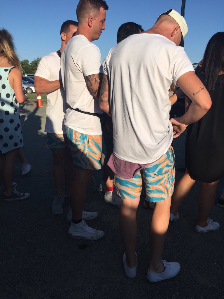 EmmaHelleur's tweet photo. There's a group of guys wearing matching clothing and bum bags to the @SIX60 concert in Riwaka #ZMSummer https://t.co/lmIU9IZ6Jw