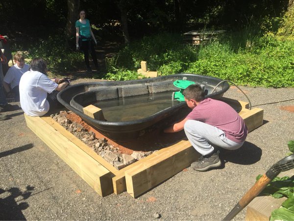 GrozoneCheshire's tweet photo. REVIEW OF THE YEAR: AUGUST. The @RotaryNW #Ryla2015 group made us a raised pond. And @salt_scape taught us whittling https://t.co/WwKmWmpErT