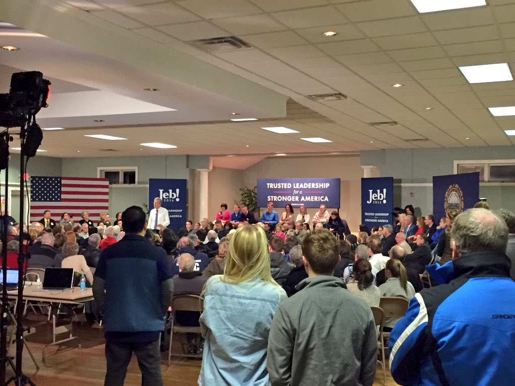 Crowd circles Jeb Bush at his stop at the Hellenic Center in Dover. <a href="/FostersDailyDem/">Fosters Daily Democrat</a>