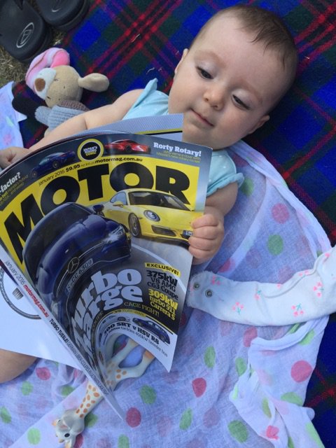 She's only 5 months old but already reading up on the latest <a href="/motor_mag/">MOTOR</a> news!!