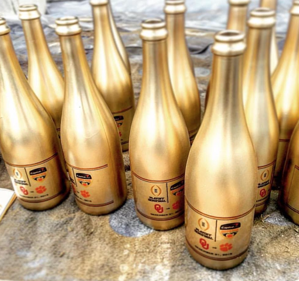darrenrovell's tweet photo. Orange Bowl gold champagne bottles (via @ecarbotti) https://t.co/myoI2BIxAi