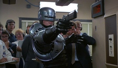 MovieDrivel's tweet photo. Who's Tougher? Robocop or RoboGeisha? #RoboBattle https://t.co/69Wv9BqNmu