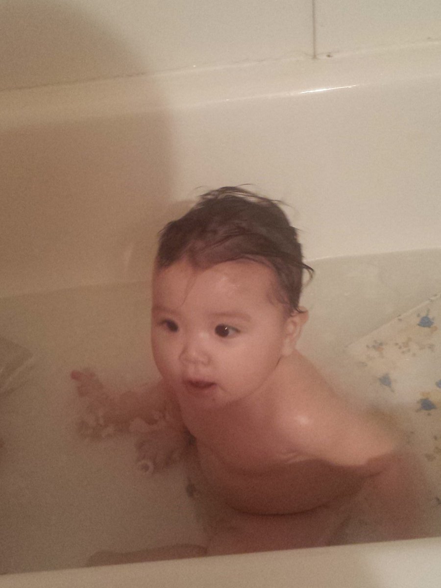 Aww my baby cousin having a bath