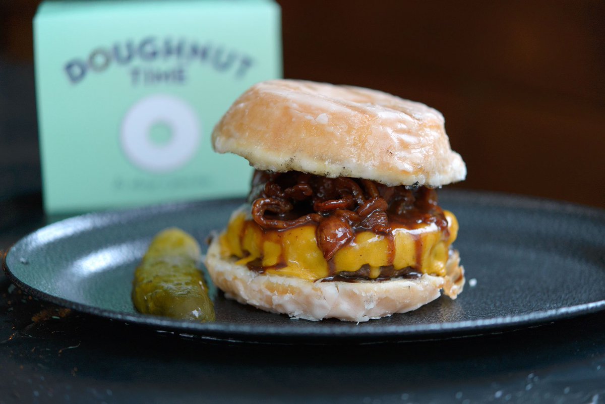 Ze Pickle's smoked-Nutella bacon burger, served in a <a href="/doughnut_time/">Doughnut Time</a> doughnut, drops today. goodfood.com.au/good-food/food…