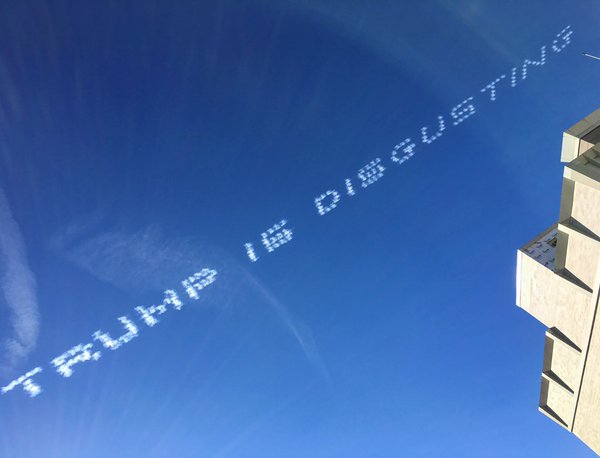 Luther Stan Pate IV behind anti-Trump skywriting Rose Parade