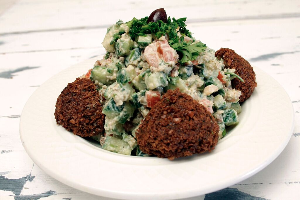 SaharaGrill's tweet photo. Our delicious Falafel Salad includes diced cucumbers, tomatoes, falafel pieces, and hummus. https://t.co/BT2xufI3LR