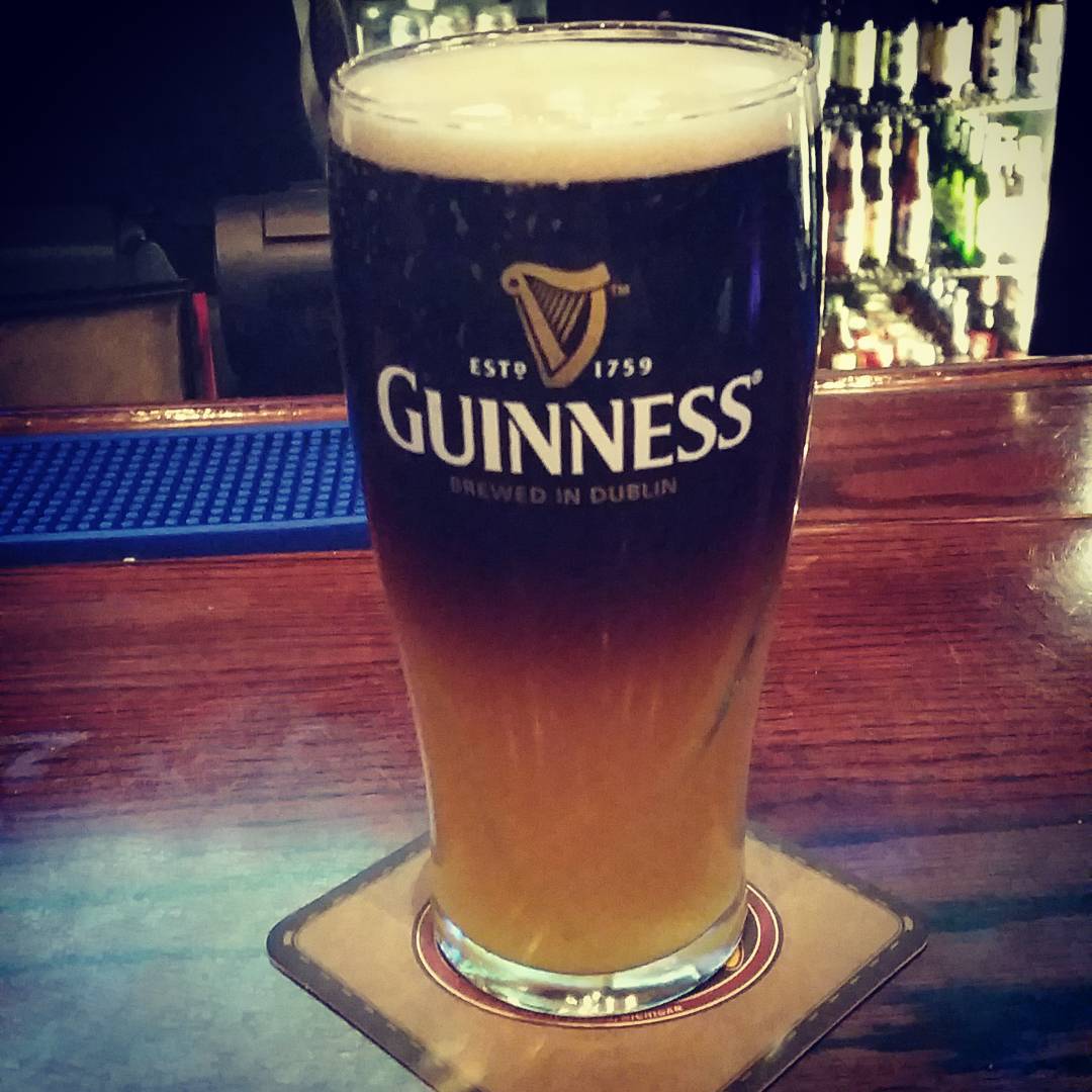 Enjoying a black and blue - half a Guinness and half a Blue Moon. #FridayFeeling #beeroclock #beertail