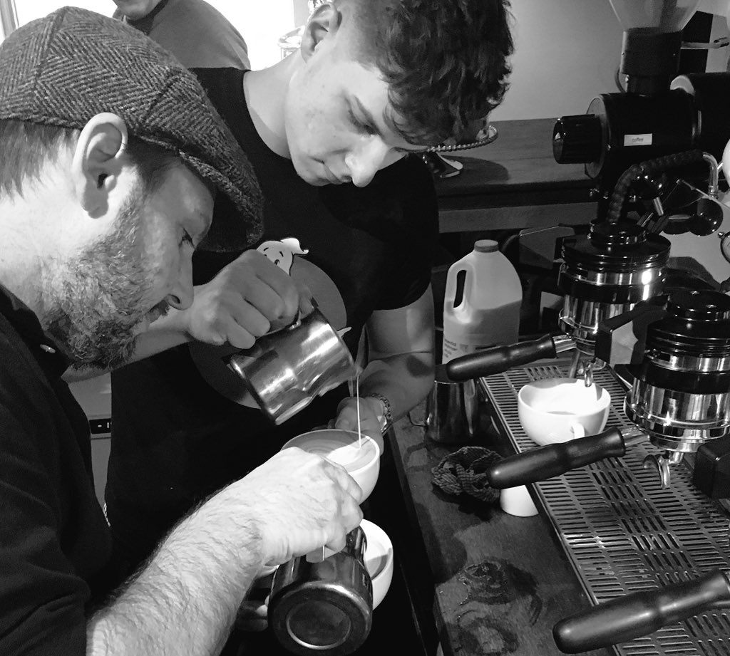 TheRealPhilC's tweet photo. Finally got someone to take pics of doing latte art with @Akhi_mych. Kid is so talented. @CoffeesmithRob legend. https://t.co/6S2fEnhRyp