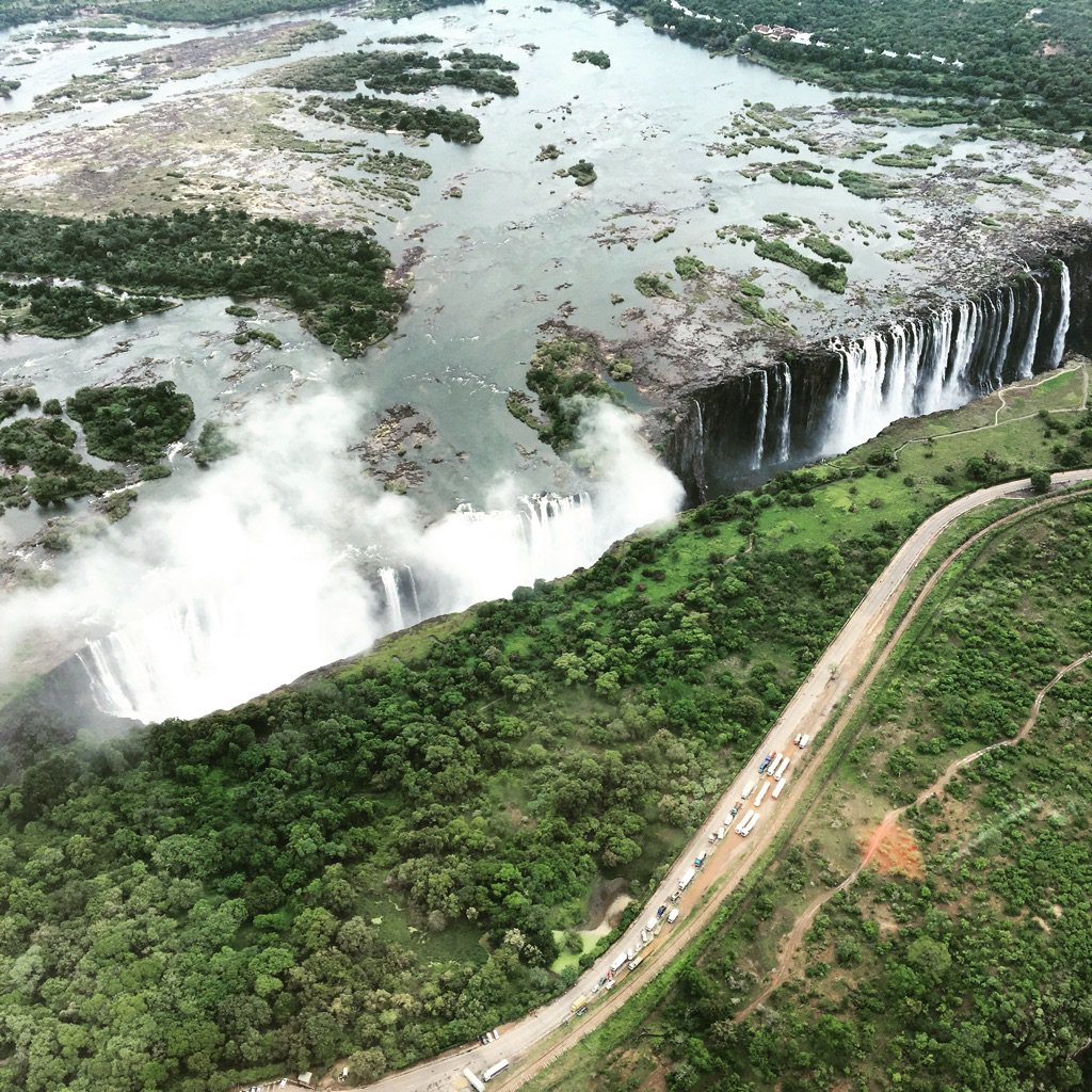 The view from the helicopter above Victoria Falls...Amazing! What looks like smoke is mist from the falls! #Zambia