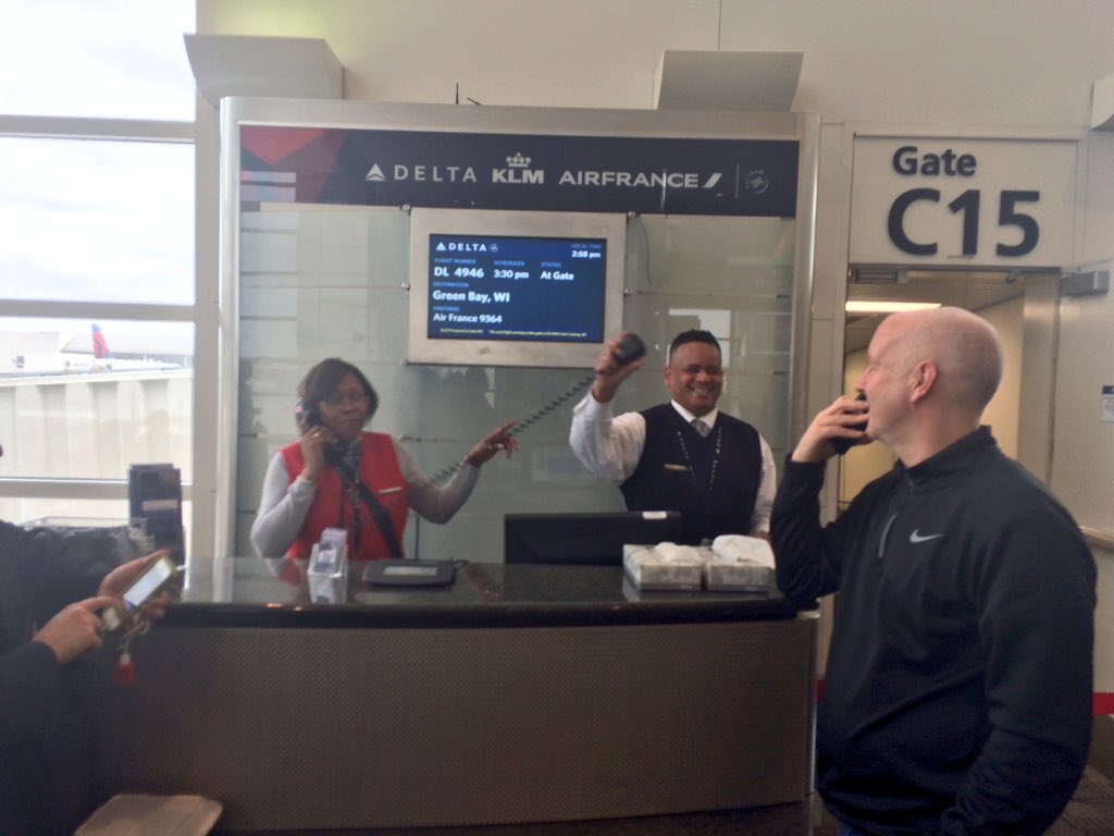 A Lions loving Delta Gate Agent Offering Kleenex To Sad Packers Fans a-lions-loving-delta-gate-agent-offering-kleenex-to-sad-packers-fans