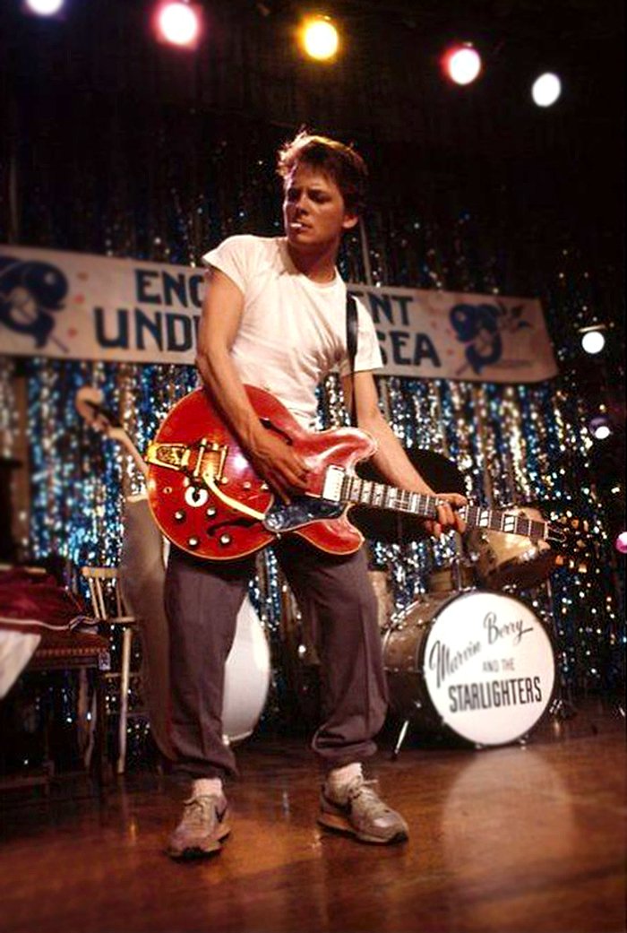 HistoryInPics's tweet photo. Michael J. Fox on set of Back to the Future, rehearsing Johnny B. Goode, 1985. https://t.co/r8IS00ZIhN