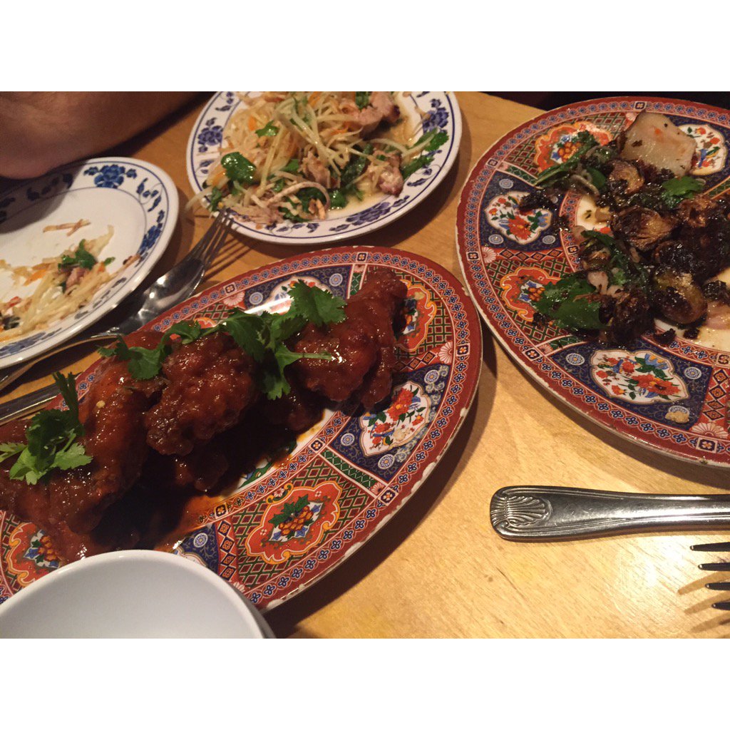 green papaya salad, grilled pork jowl and chicken wings at <a href="/pigandkhao/">Pig & Khao</a>. delicious.