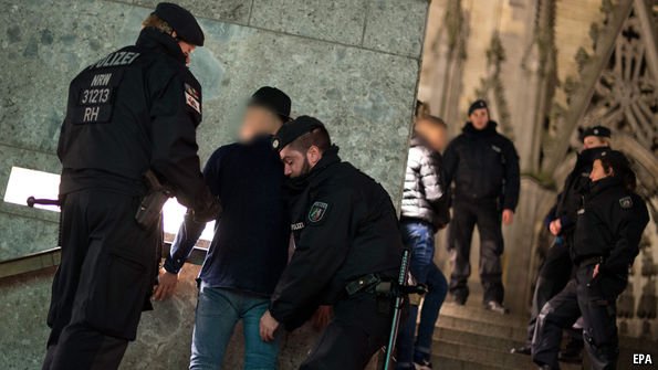 TheEconomist's tweet photo. After attacks on women on New Year's Day, German anti-refugee feeling may be on the rise https://t.co/iDdpaa4mWT https://t.co/xd7VyuADQX