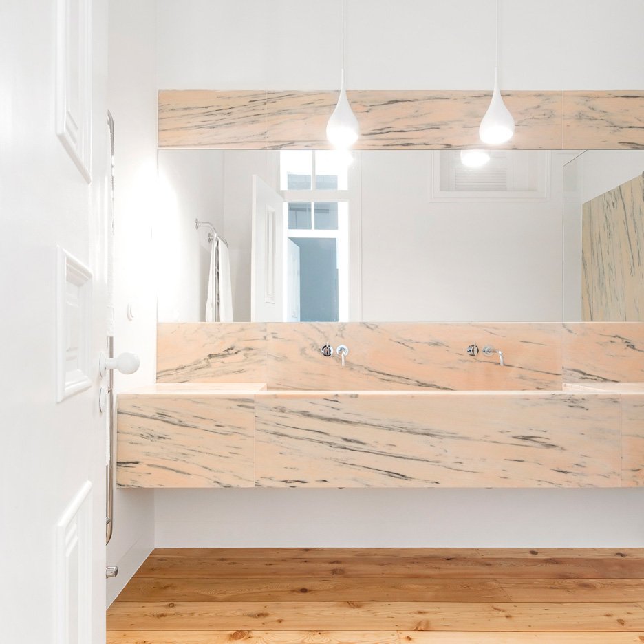 Marble bathrooms added to renovated 19th-century Lisbon apartment: dezeen.com/?p=828633 #interiordesign