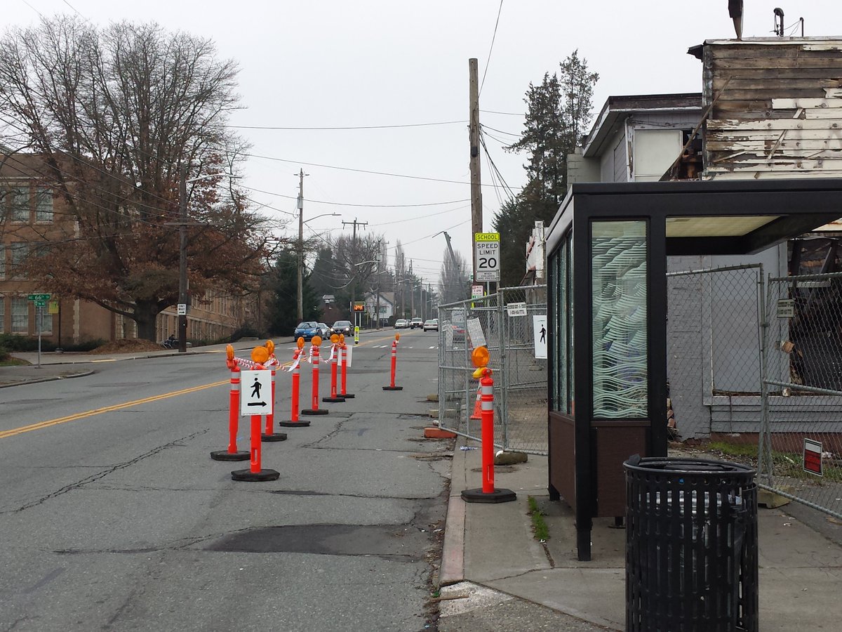 SEA_DOTr's tweet photo. 5ft walkway, 11ft lane. People drive slower past the walkway, and kids now have a protected space to run for the bus https://t.co/zw0MMqZUnm