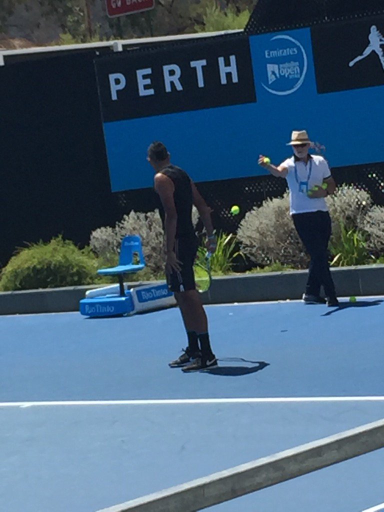 NorlailaKyrgios's tweet photo. George doing his duties as ball boy at Nick's practise session again! C'mon Aussies..#HopmanCup https://t.co/byLGqLpq7U