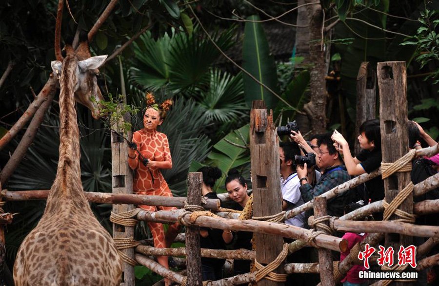 PDChina's tweet photo. Human body painting seen in a zoo in #Sanya, S #China's Hainan Sunday, to evoke animal protection. https://t.co/EUPCQ6M25g