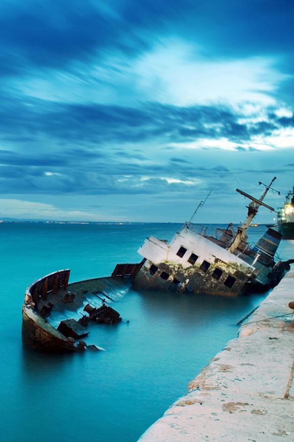 Shipwreck in Fira Old Port, Santorini, Greece.
