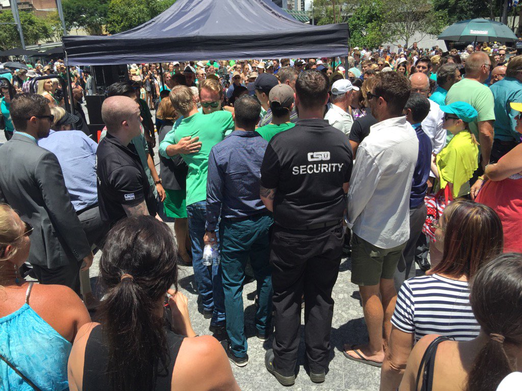 Long line of people have come to hug members of Cole Miller's family.