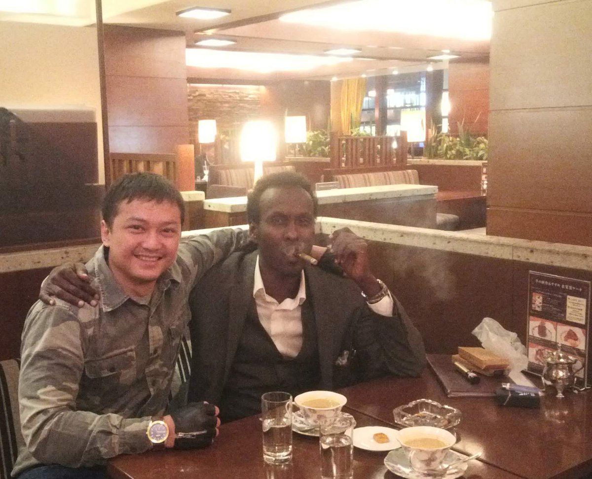 Shimada_D's tweet photo. Late night conversation and having a cigar with my best Bulhan Hersi here in Tokyo, Japan. https://t.co/rp8rVSIFFT