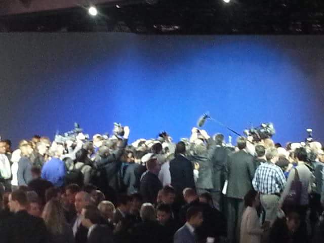 Drew_E_Moses's tweet photo. There's a Chevy Bolt somewhere under that pile of cameras. #NAIAS2016 #RugbyScrum https://t.co/drWuQpCnlI