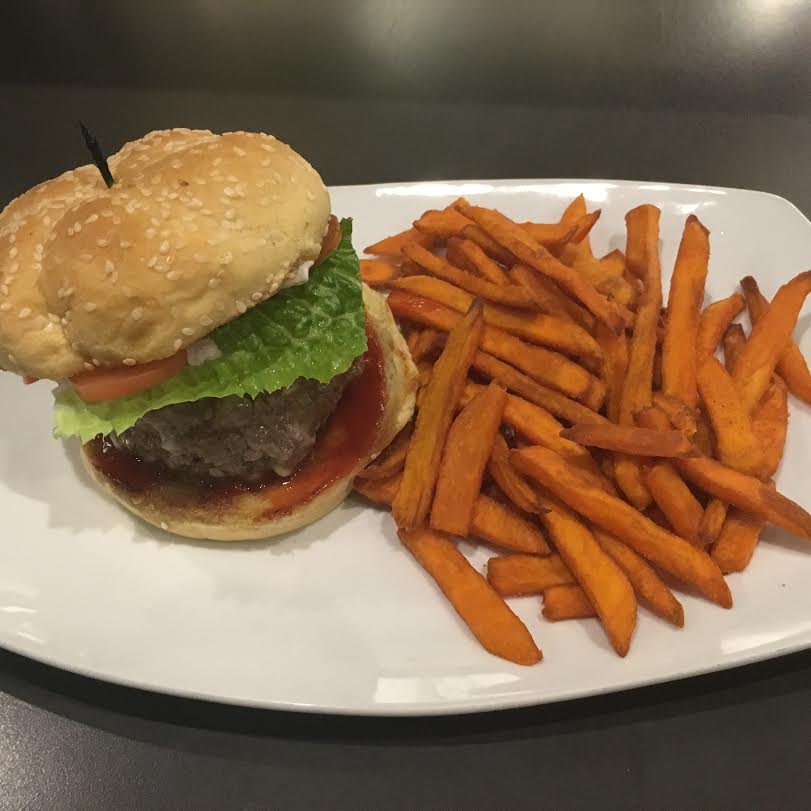 THE ROYALE SULTAN BURGER: Beef and lamb with lettuce, tomatoes, onions, garlic mint labneh &amp; pomegranate ketchup.