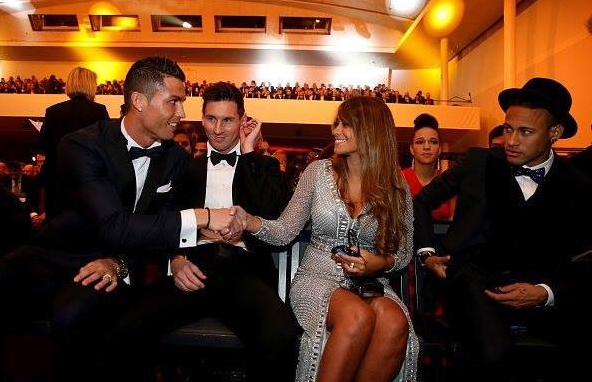 Cristiano Ronaldo leans over Leo Messi to shake his girlfriends hand, Neymar has daggers in his eyes