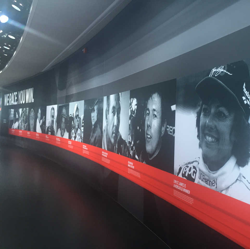 2morrowknight's tweet photo. A great wall of photos: famous drivers who raced &amp; won in @Ford cars. #TalkWithFord #FordNAIAS #ad https://t.co/qQwAaY10Vr