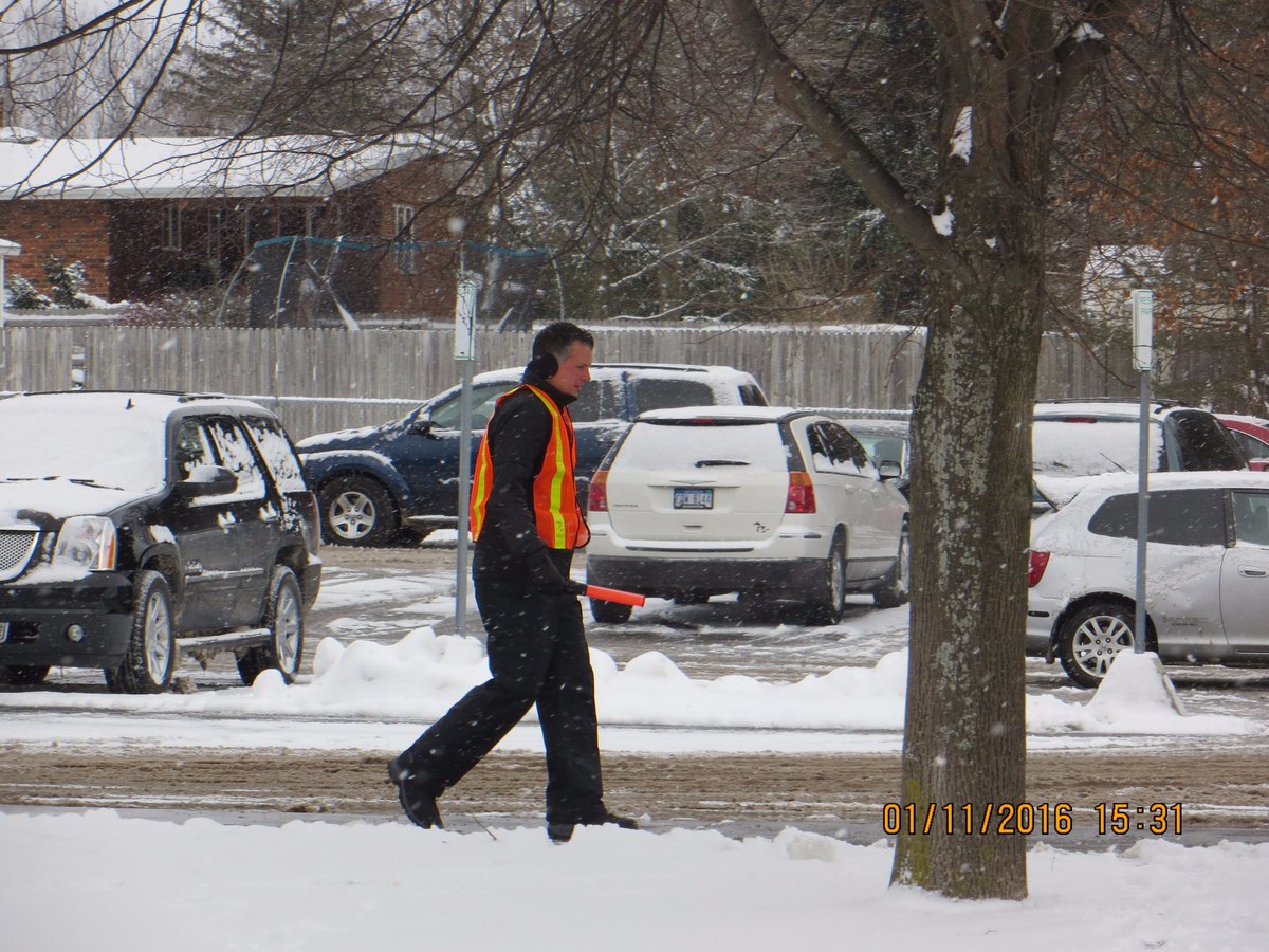 Our fearless leader coming back from parking lot duty. 
 #AWESOMEPRINCIPAL