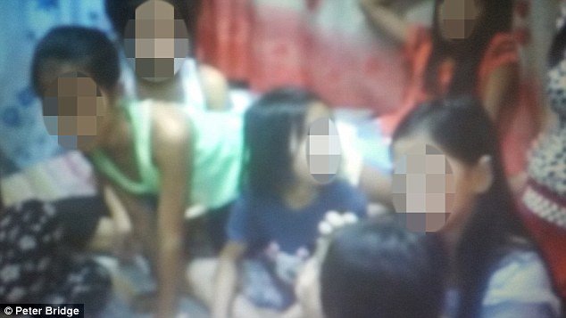 Inside a Filipino cybersex den where paedophiles pick girls to be abused on...