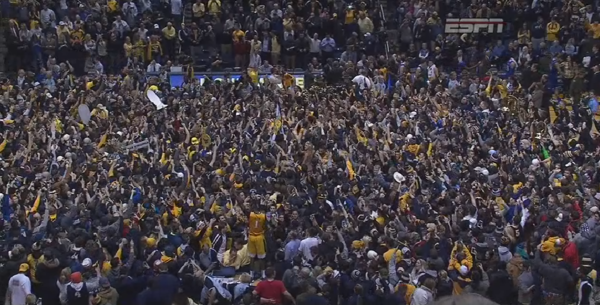 SportsCenter's tweet photo. Down goes No. 1! West Virginia defeats Kansas, 74-63.

It's the Mountaineers' 1st win vs AP No. 1 team since 1983. https://t.co/zU37E2uX0X