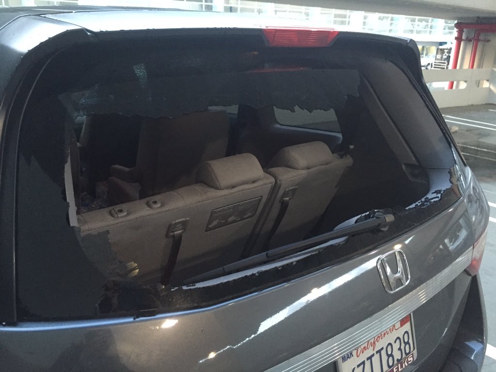 shivani_saxena's tweet photo. What happens when your friend parks their car in the Tenderloin so you can hang out for a bit #brokenwindow #hellosf https://t.co/5CwlT6tDN7