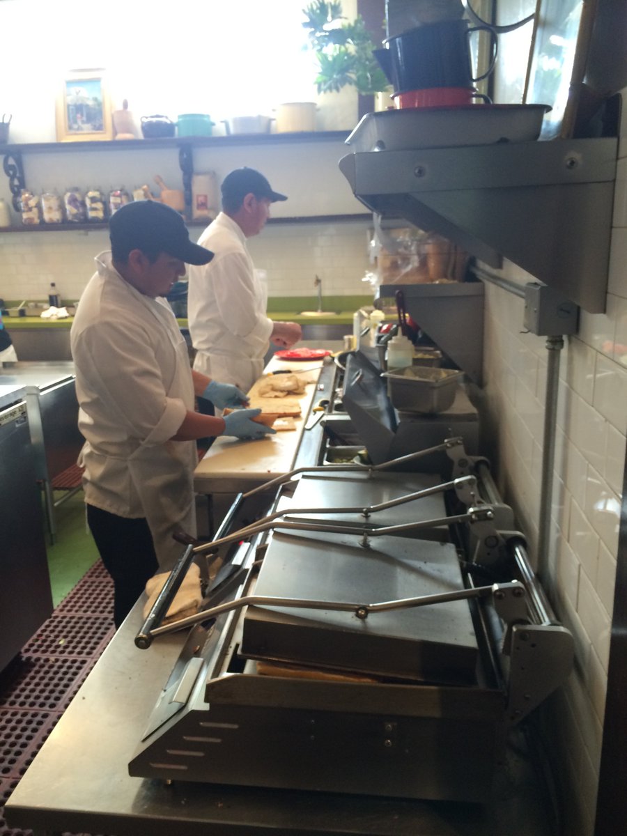 Our cooks are whipping up tasty Sol Food sandwiches.