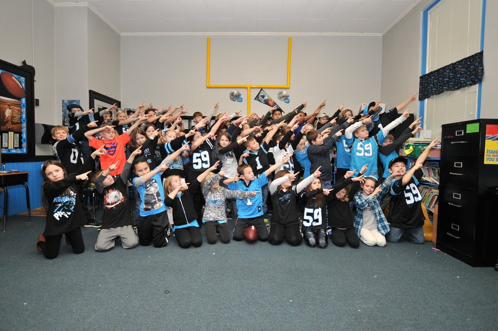 eeswright's tweet photo. @wsoctv third graders at Enochville Elementary supporting the Panthers in the Panthers themed class #panthernation https://t.co/1rqTgIj8so