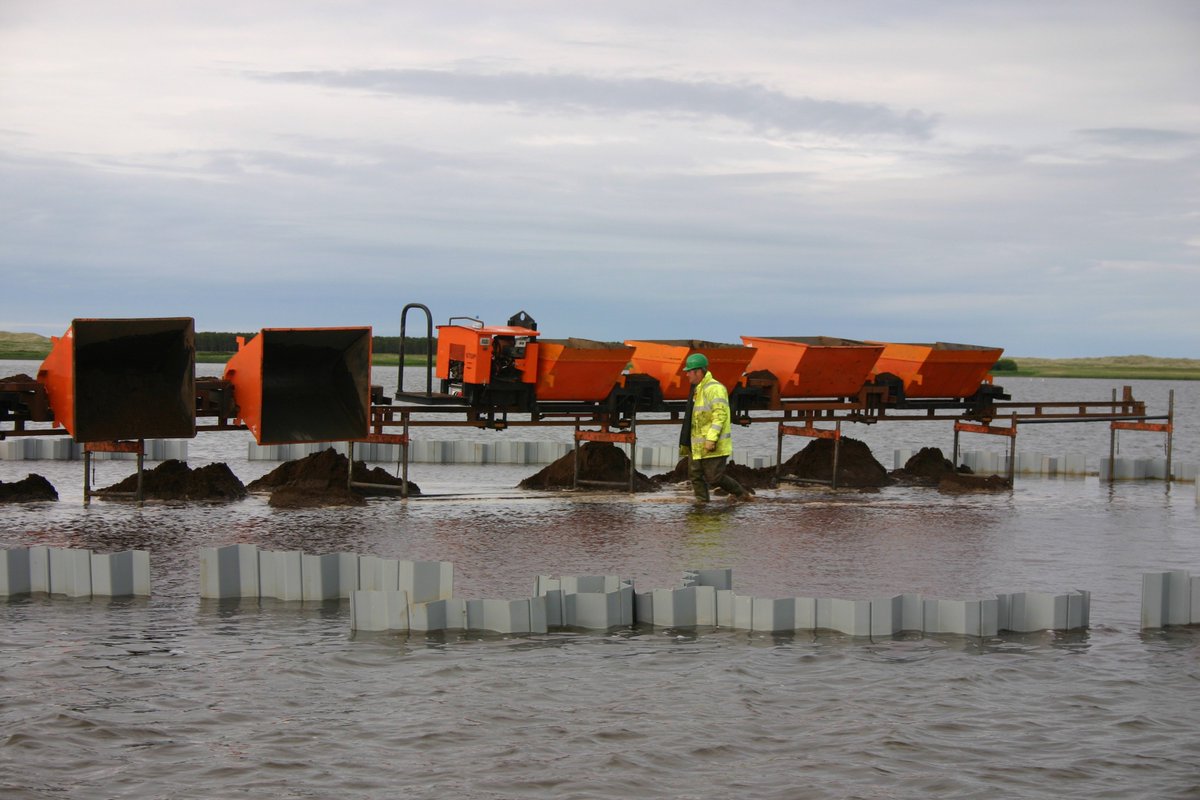 #Monorail transporting locally won material to create islands for habitat diversity in a large lake