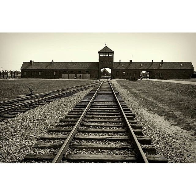 Main gate and railroad to nazi concentration camp of Auschwitz Birkenau