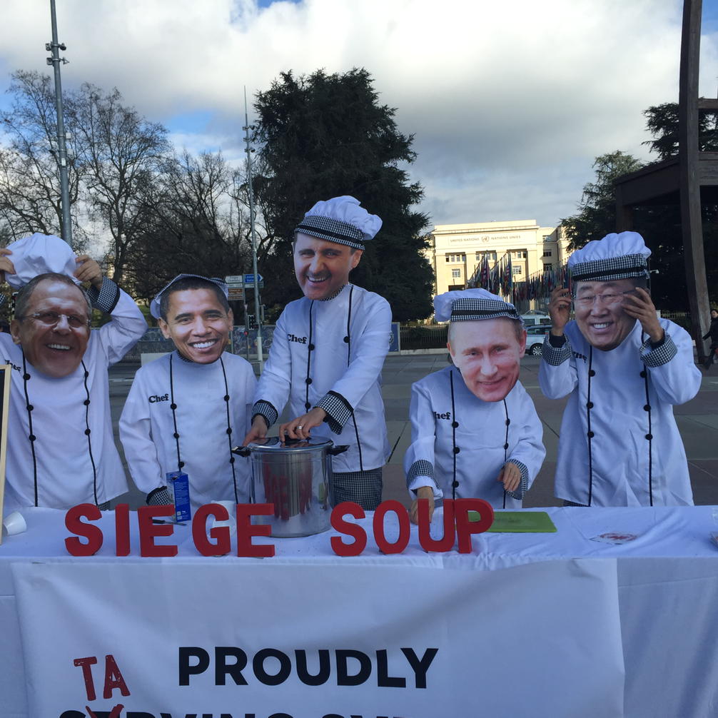 SominiSengupta's tweet photo. Protest in front of UN Geneva: masters of the universe serving "siege soup" https://t.co/sBPyU0Pm5x
