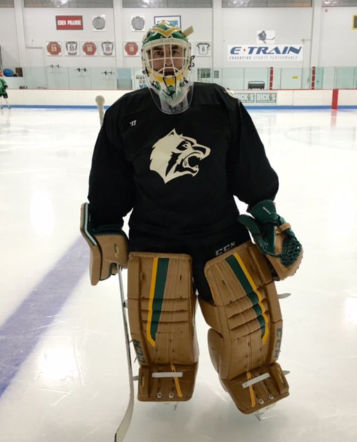 Don Beaupre of the Minnesota North Stars Alumni blocks a shot from