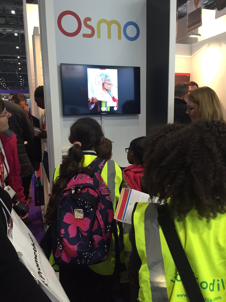 ExertisUnlimit's tweet photo. Creative play in action: young visitors to @Bett_show enthralled by @PlayOsmo iPad gaming system #StandF120 https://t.co/r1lrarSYco