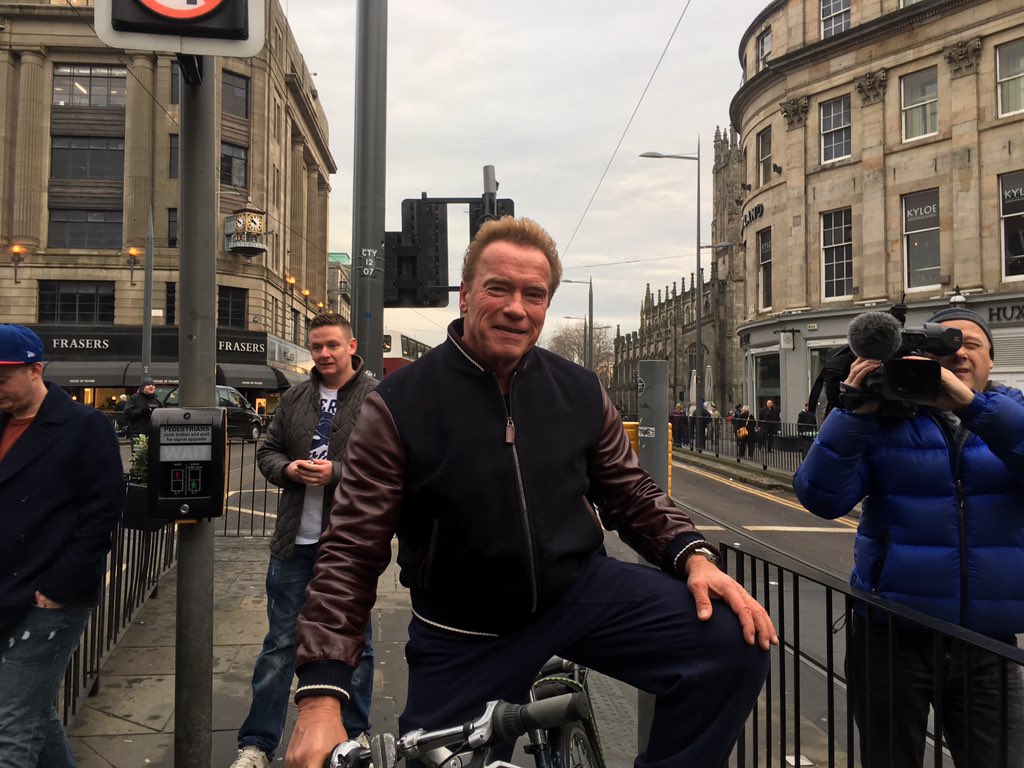 Schwarzenegger's tweet image. My first Edinburgh bike ride. A beautiful city! Catch my tour on Snapchat: ArnoldSchnitzel.