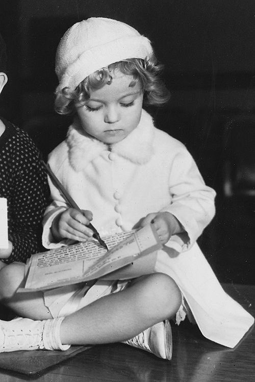Shirley Temple signing her first film contract, 1932. 
